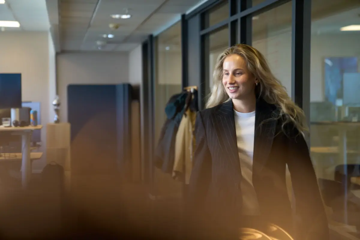 Smiling colleague in the office corridor
